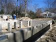 Cement pillars in center of in crawl space are ready for modular home installation