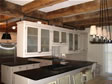 Cabinets designed to hang form the ceiling give a unique look to this custom modular home kitchen