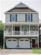 Unique two-story boosts a full porch with 2-car garage underneath in this Monmouth County, Ocean Grove, NJ modular 