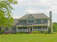 Enjoy country living in this 2-story with farm porch and fireplace