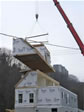 Lifting the completely finished interior second floor section for a new home in Ocean County, Lavallette, NJ