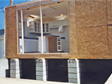 View of first floor modular home section being installed on a crawl space foundation