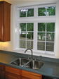 Bright and airy space above the kitchen sink was designed to let maximum light in and grandest views